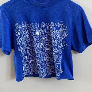 cropped blue shirt with cartoon characters on it